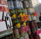 A woman walks in front of a supermarket in Caracas